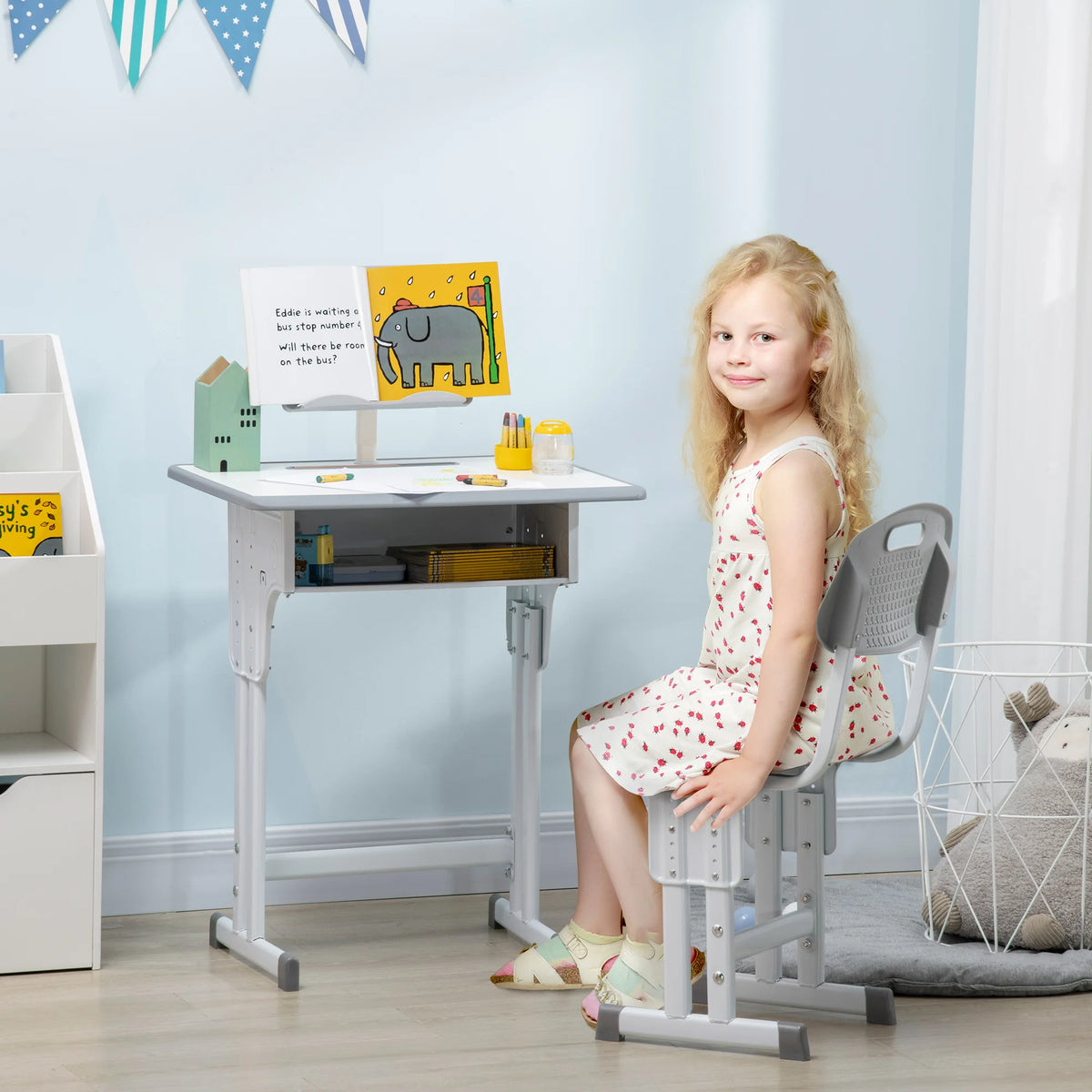 Kids study desk shown at its full 102cm height with chair