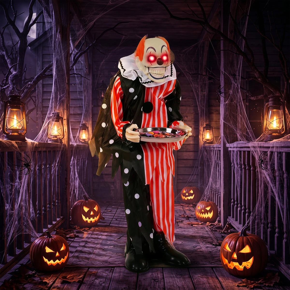 Clown prop with polka dot and striped outfit holding a candy tray