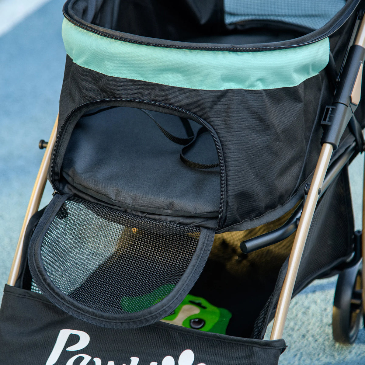 Bottom storage basket under a pet stroller
