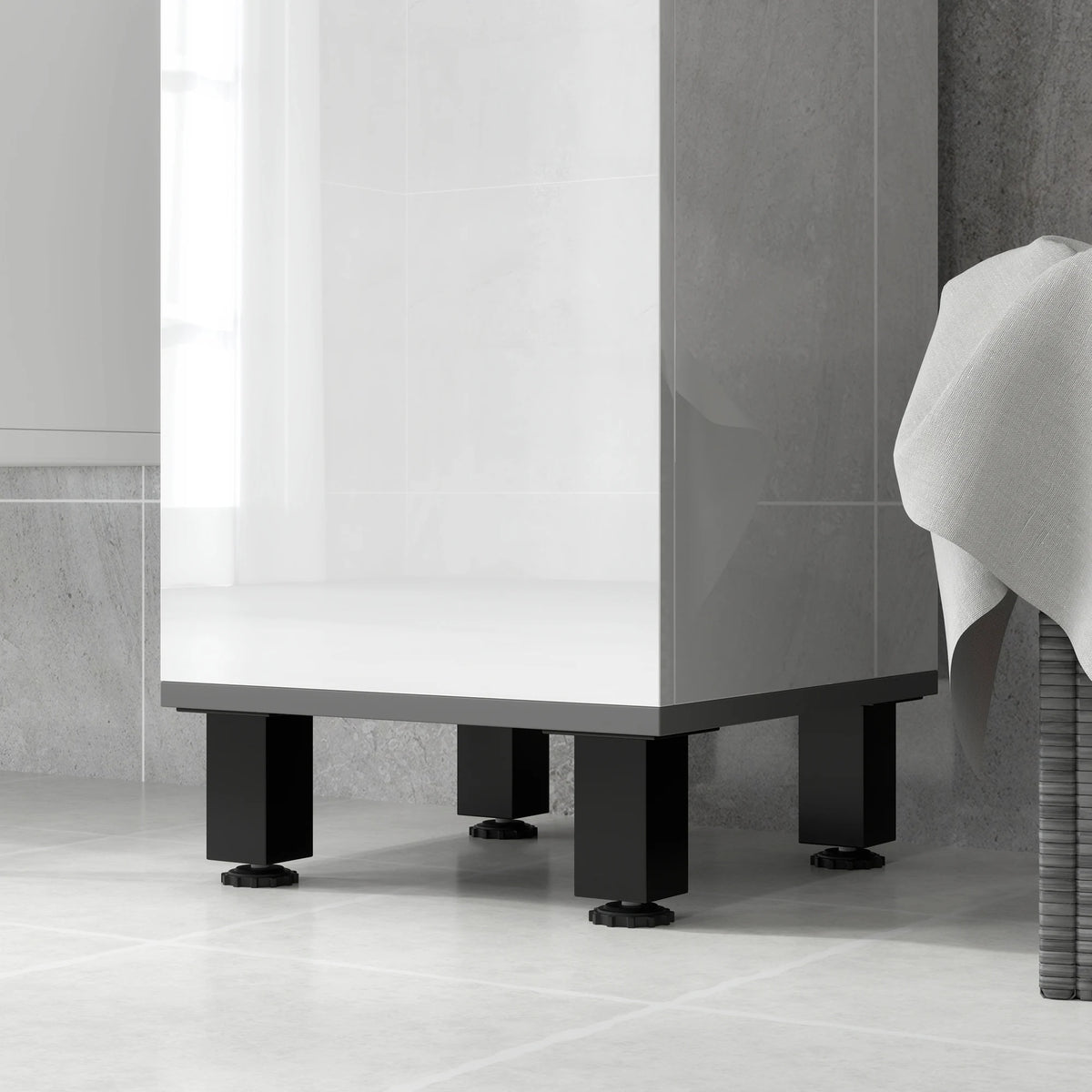 Adjustable foot pads on the base of a bathroom cabinet