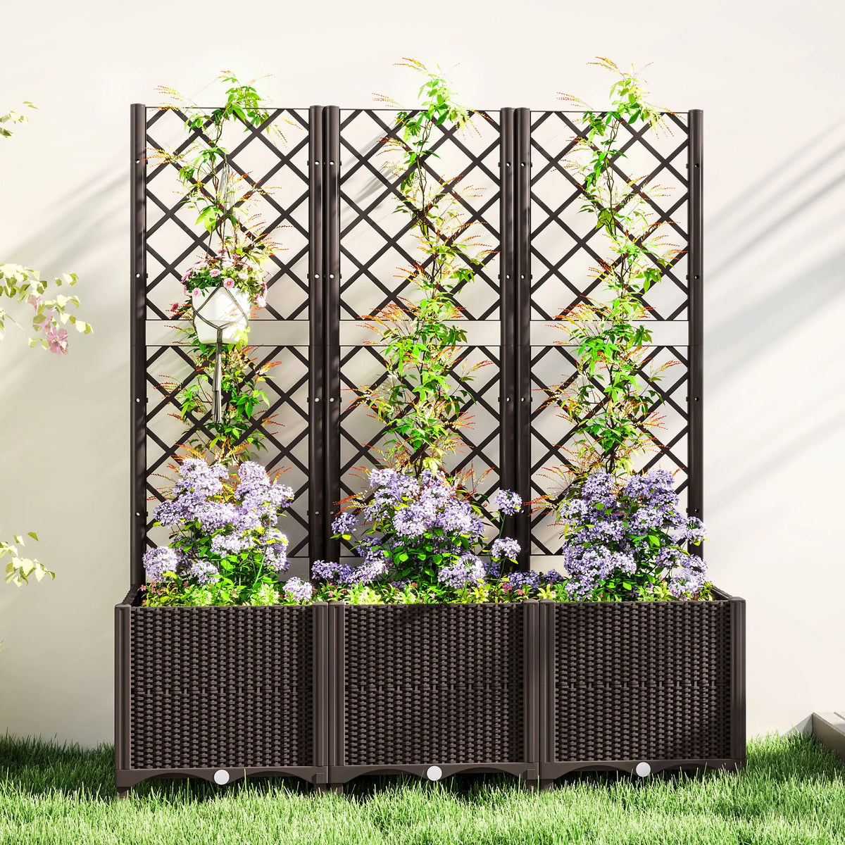 Raised planter with trellis positioned against a garden wall