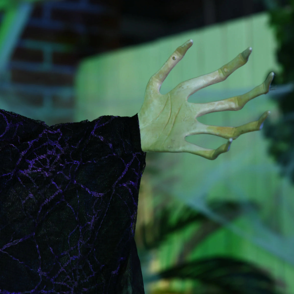 Hanging Witch Prop, Life-Size with Light-Up Eyes and Talking Sound