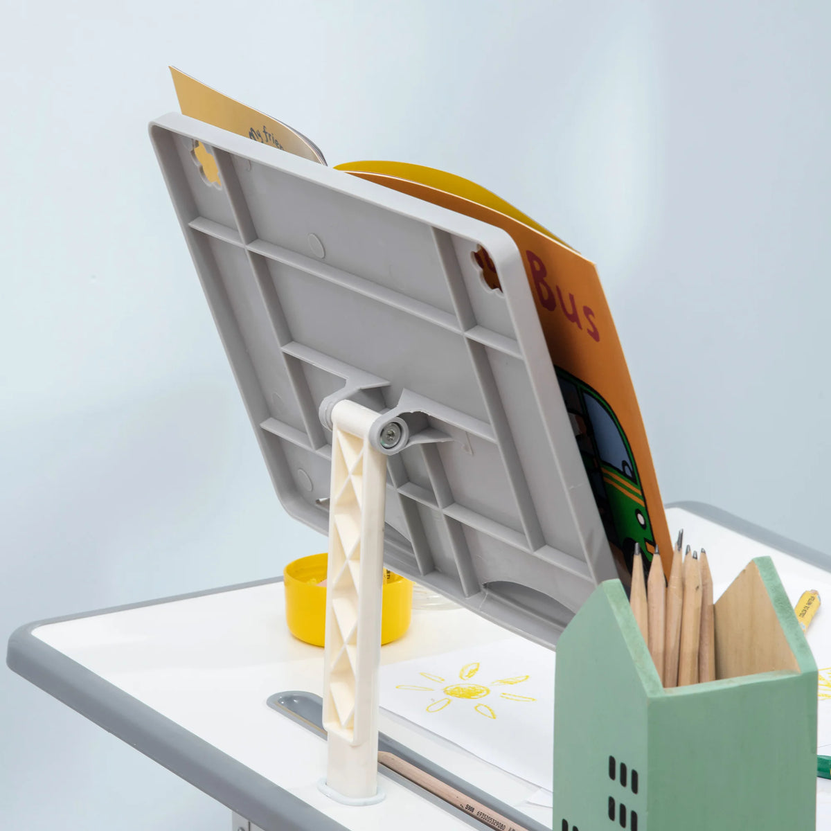 Side hook on a childrens desk holding a school bag