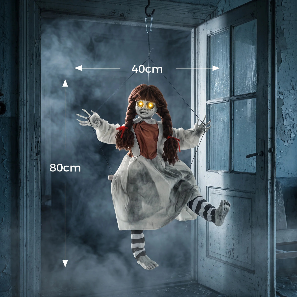 Yellow light up eyes on a hanging girl Halloween decoration