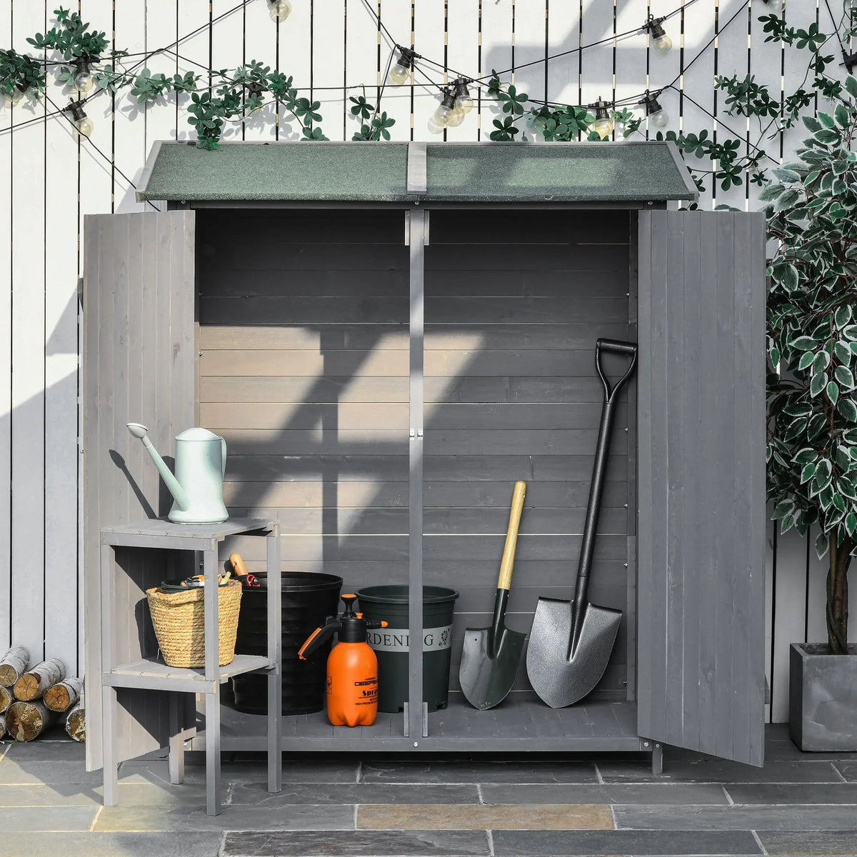 Shed doors open showing three partitions and tool hooks