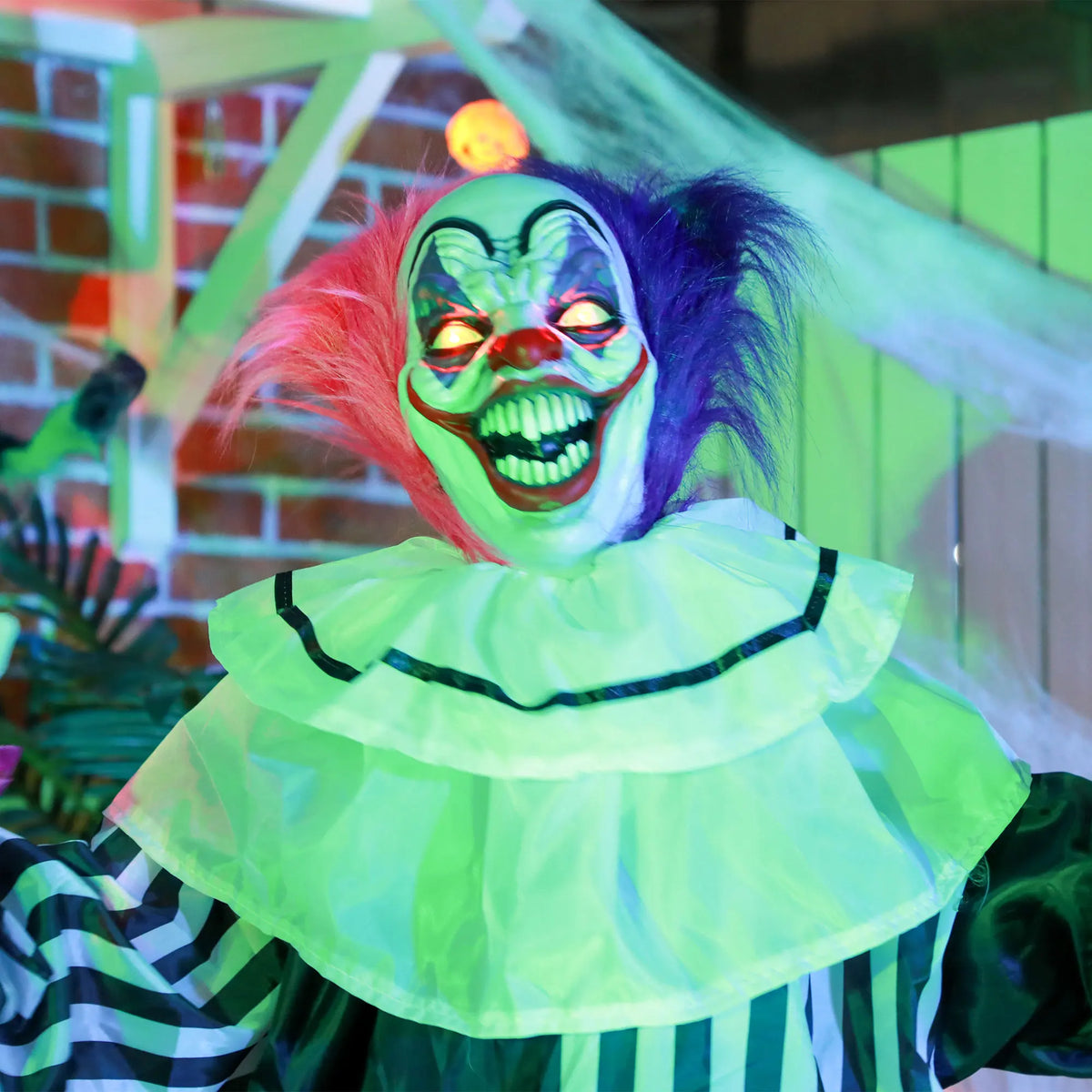 Animated clown prop shown beside a doorway for scale